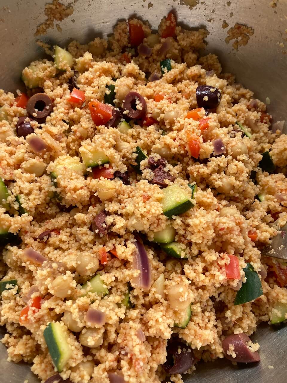 mixing the vegetables with couscous