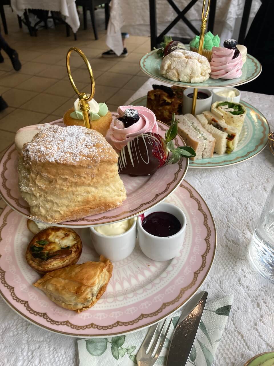 savouring high tea for the July edition of currenly