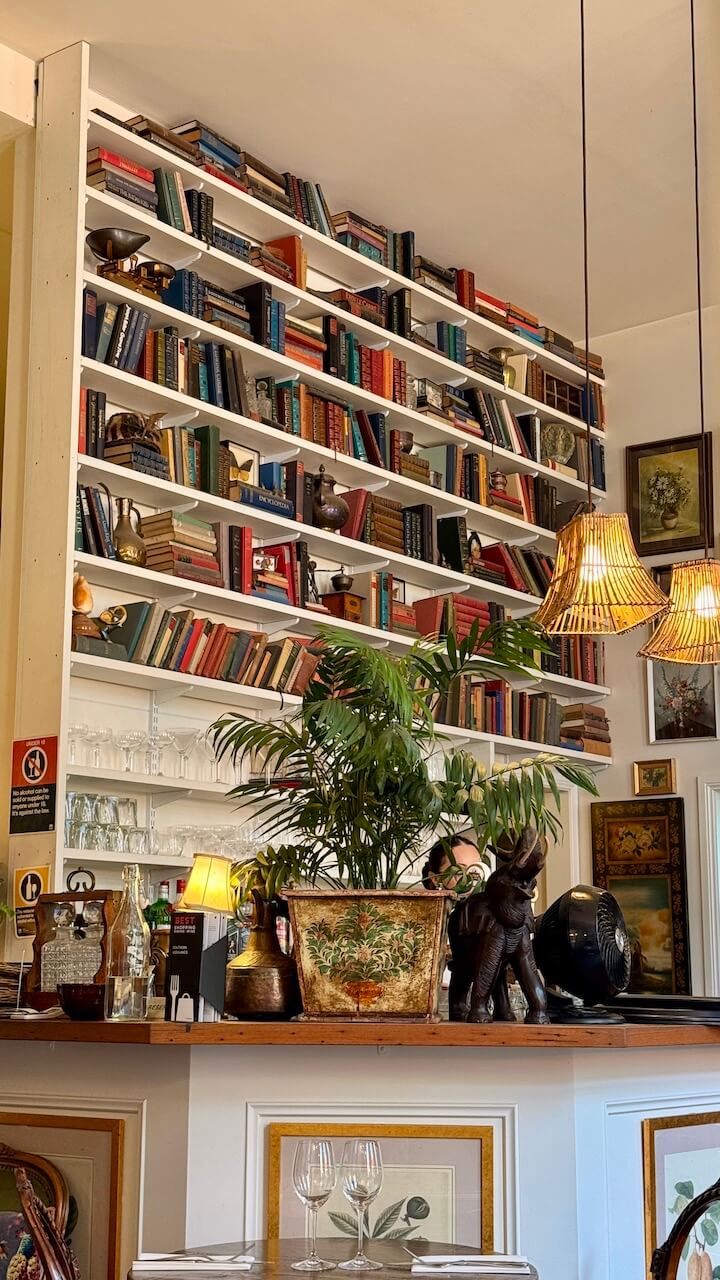 Bookcase and vintage decor inside Harry’s on Green Lane