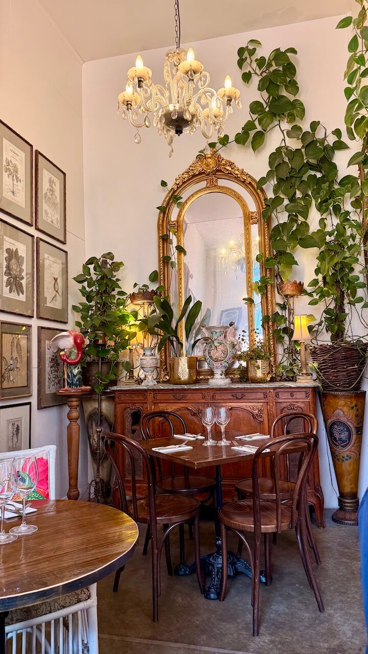 Plants, botanical prints and dining tables inside Harry’s on Green Lane